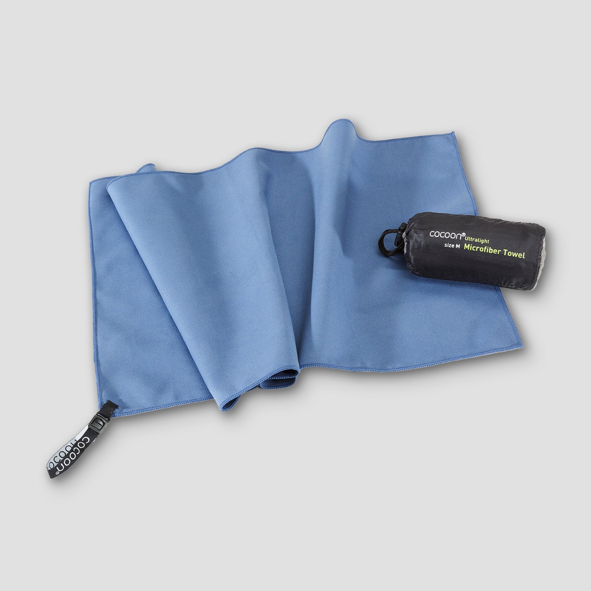 COCOON ultralight microfiber towel spread out, showing soft, quick-drying fabric ideal for travel and outdoor activities.