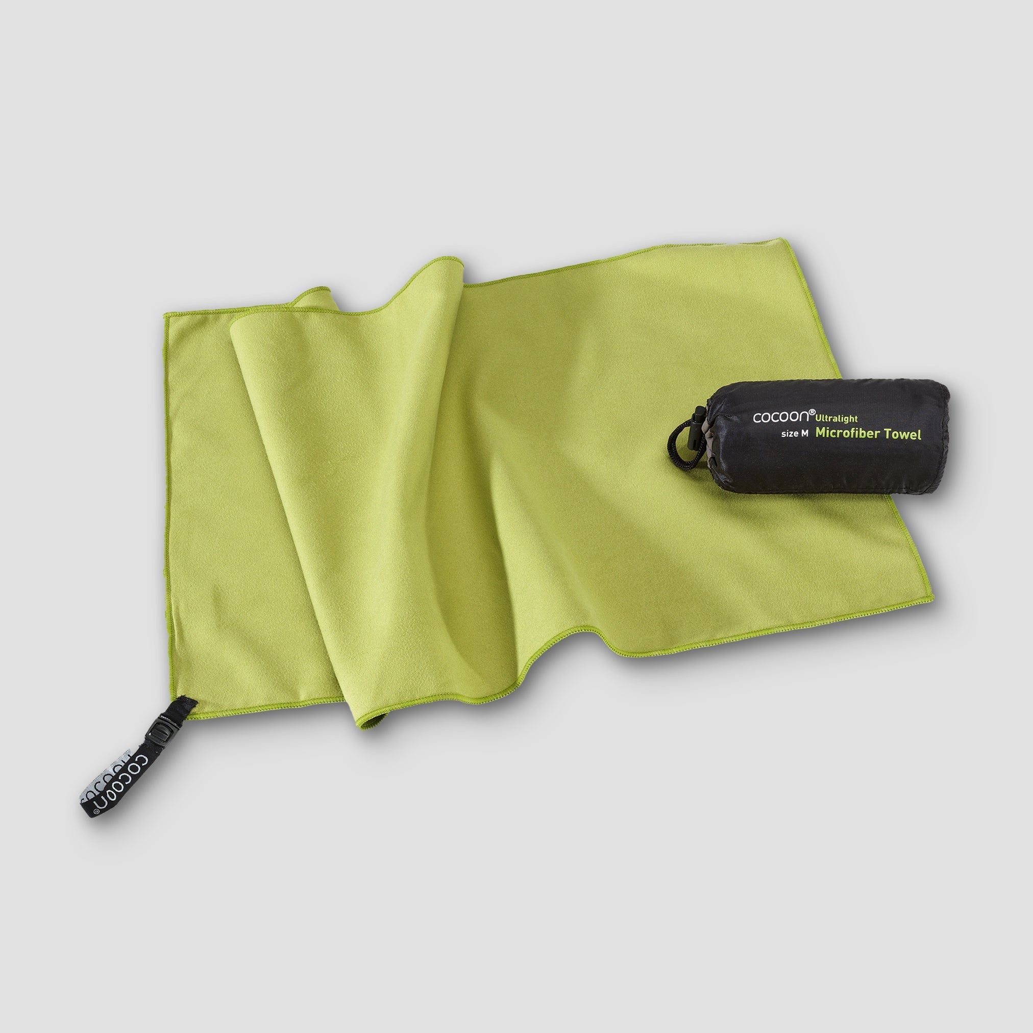 COCOON ultralight microfiber towel spread out, showing its soft, quick-drying fabric ideal for travel and outdoor activities.