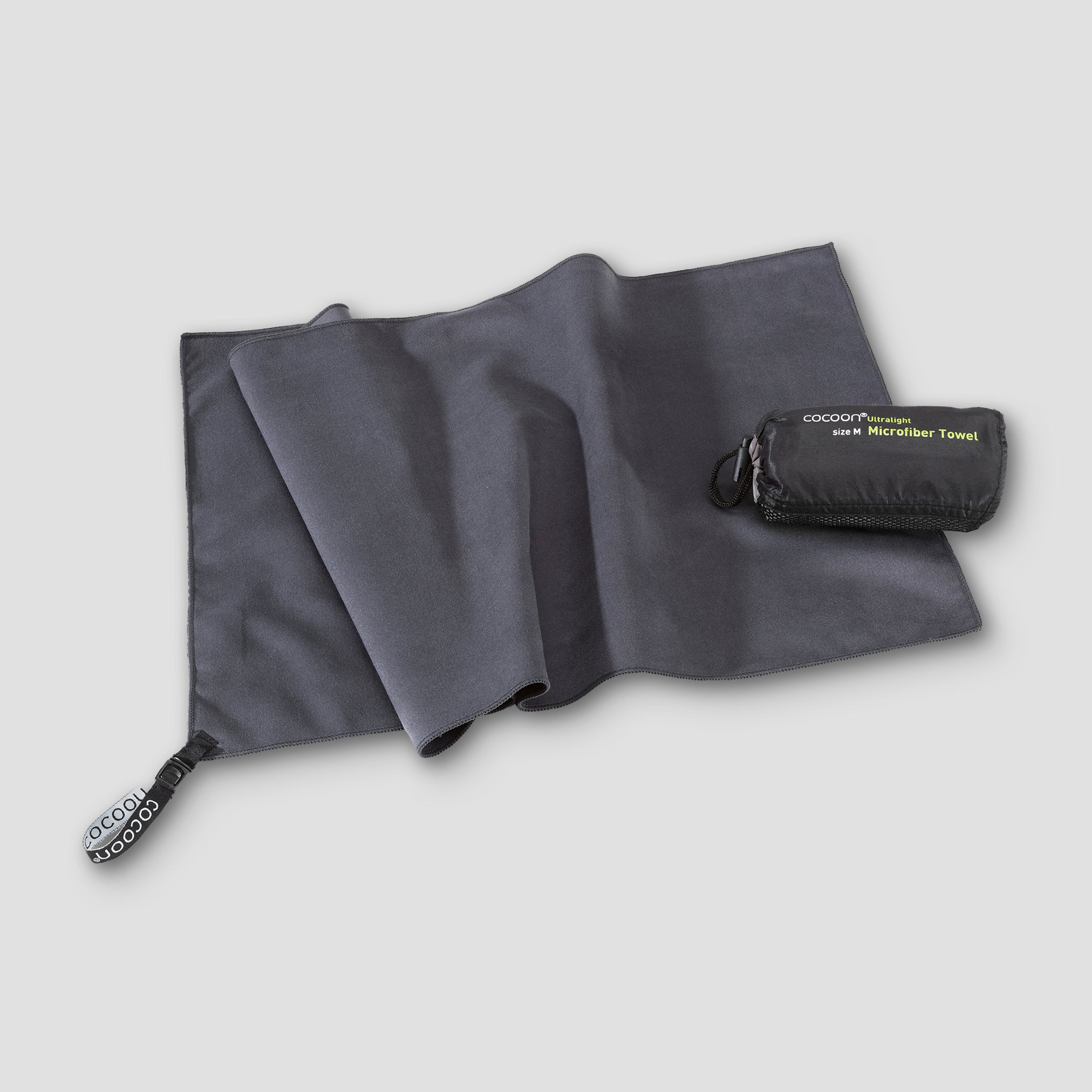 COCOON ultralight microfiber towel spread out, showing its soft, quick-drying fabric ideal for travel and outdoor activities.