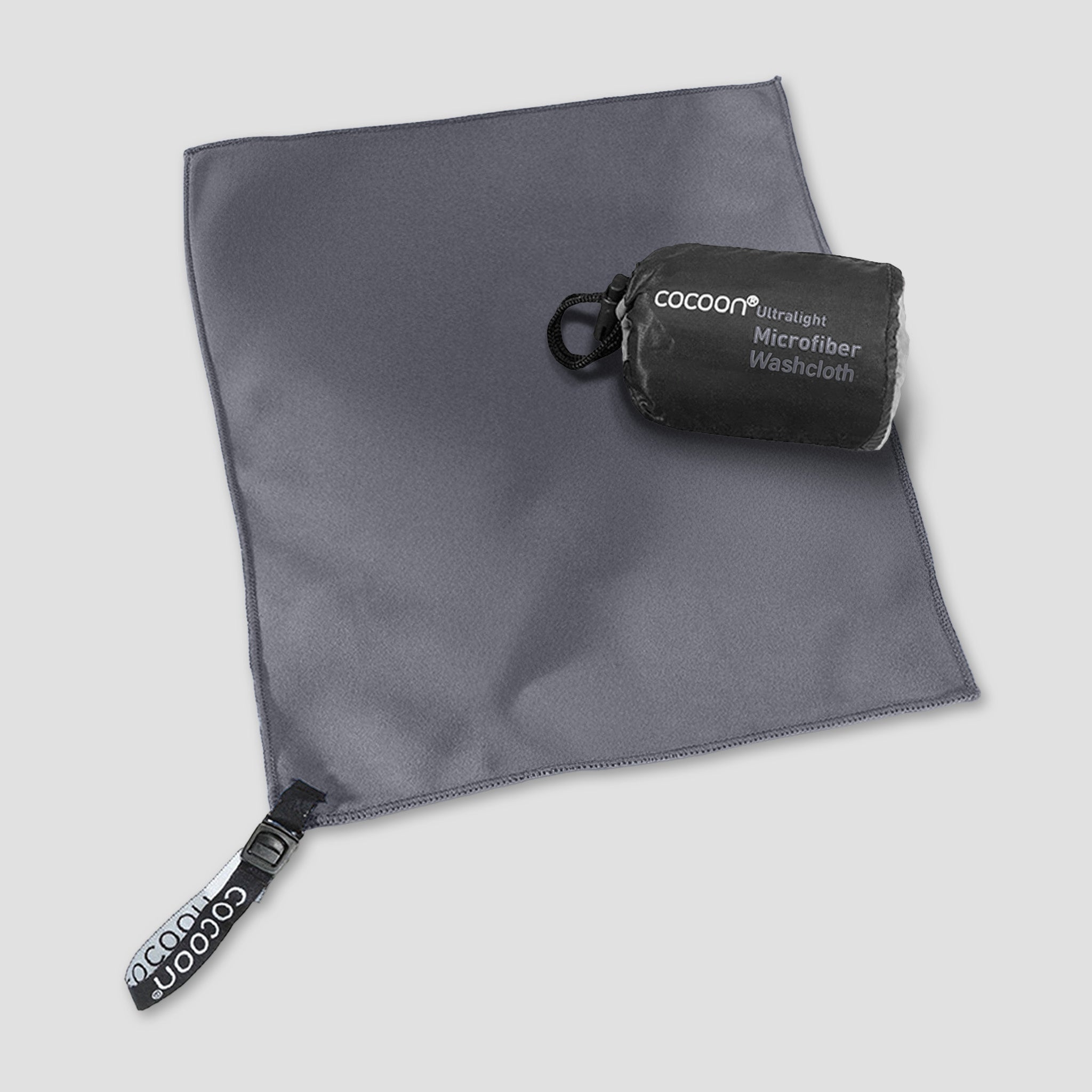 Light blue COCOON ultralight microfiber towel spread out, showcasing its soft, quick-drying fabric perfect for travel and outdoor use.