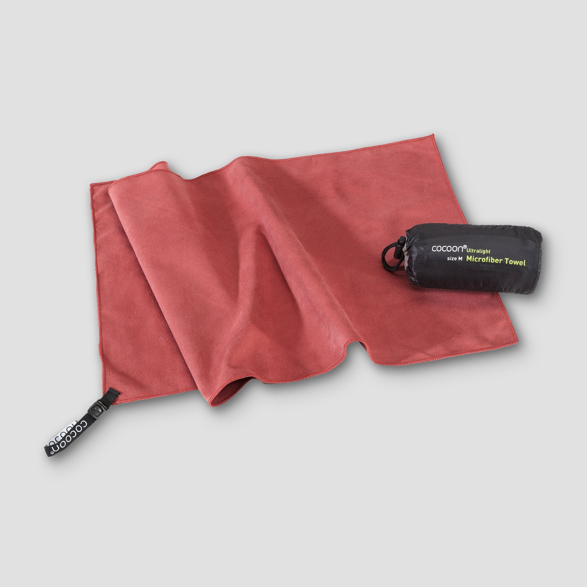 Ultralight COCOON microfiber towel spread open, showing soft, absorbent fabric ideal for travel and outdoor activities.