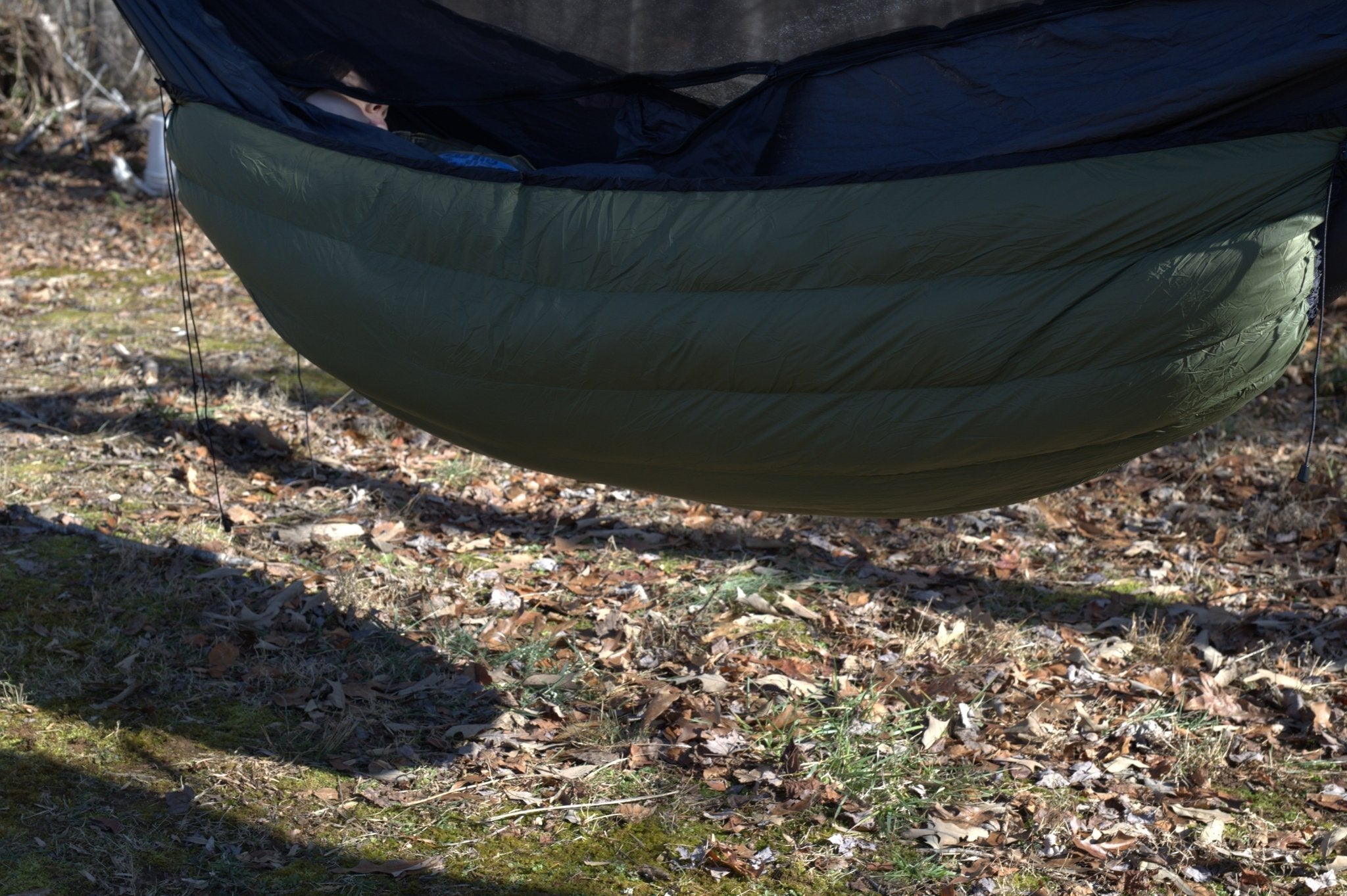 Hanging High Hammocks EmberNest Underquilt 30°F rated, designed for hammock camping and outdoor adventures.