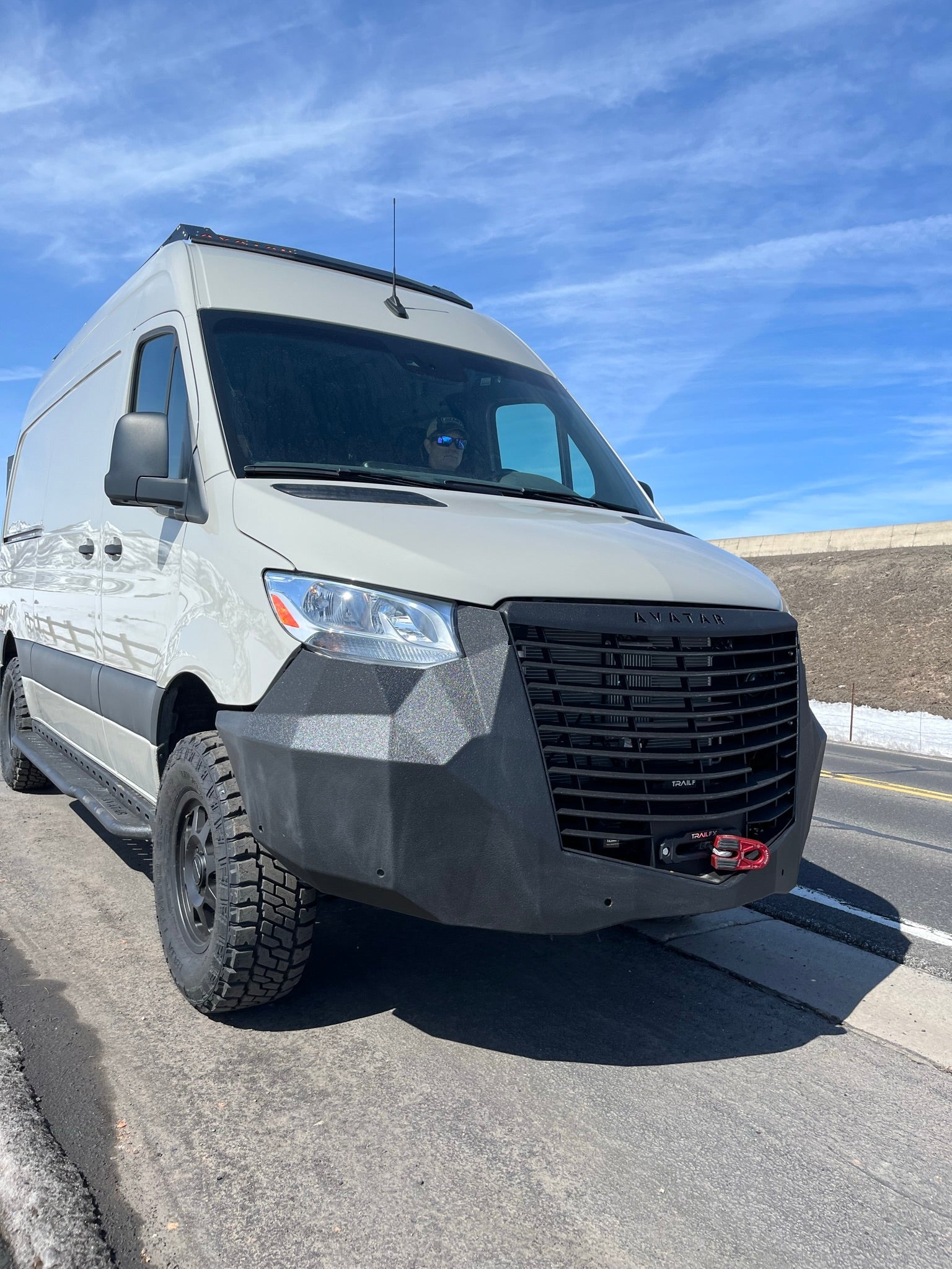 Avatar Offroad Ultra Rack low profile roof rack installed on a Sprinter van, designed for secure cargo storage and transport.