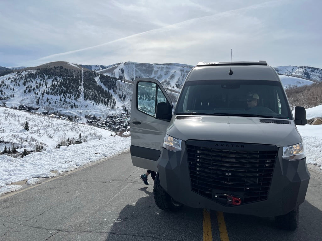 Avatar Offroad Ultra Rack low profile roof rack for Sprinter vans, shown installed on vehicle with sleek, aerodynamic design.