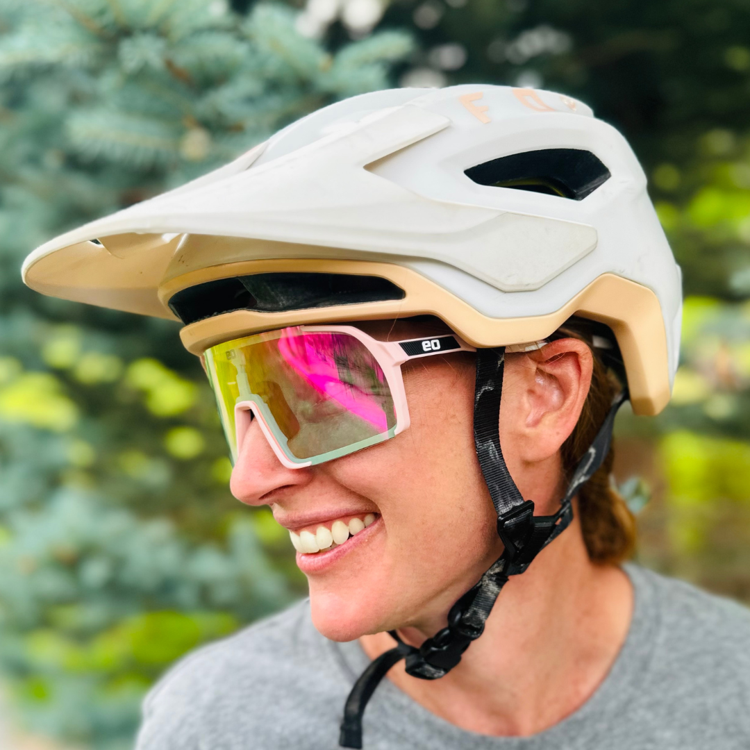 Eastern Outer Uno Mas Photochromic+ sunglasses with a pink frame, showcasing lenses adapting to light conditions.