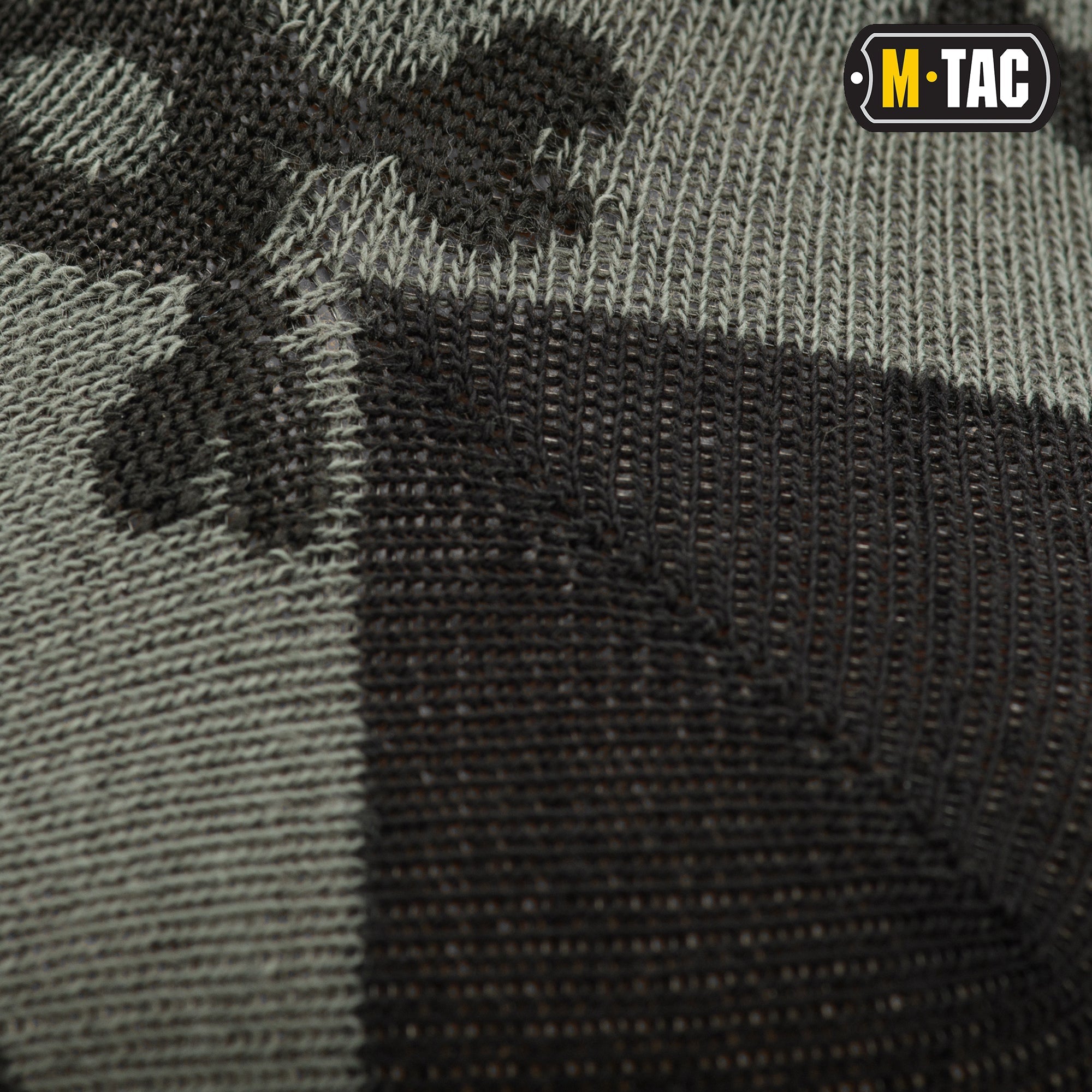 Lightweight M-TAC mid-calf socks featuring a pirate skull design, ideal for tactical or casual wear.