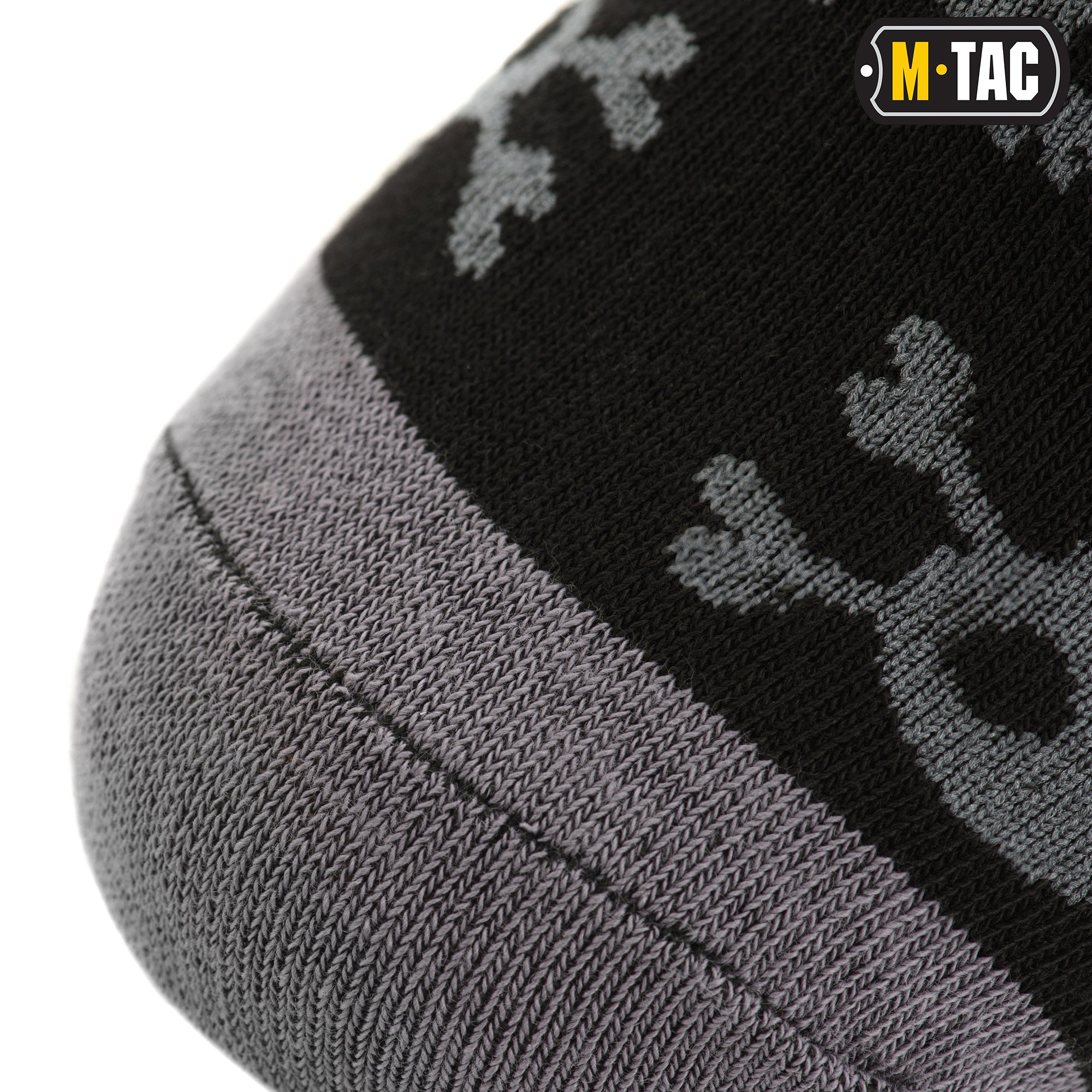 Lightweight M-Tac mid-calf socks featuring a pirate skull design, perfect for tactical or casual wear.
