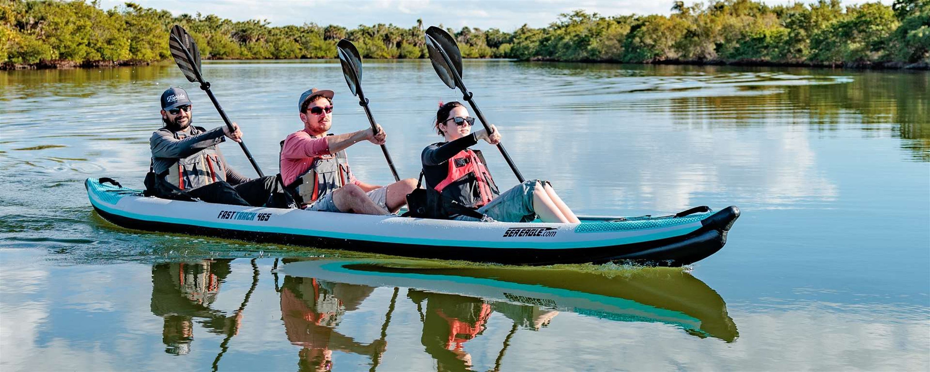 Backcountry Sportsman 465ft FastTrack V-bottom 3-person kayak package with paddles and safety gear, ready for water adventure.