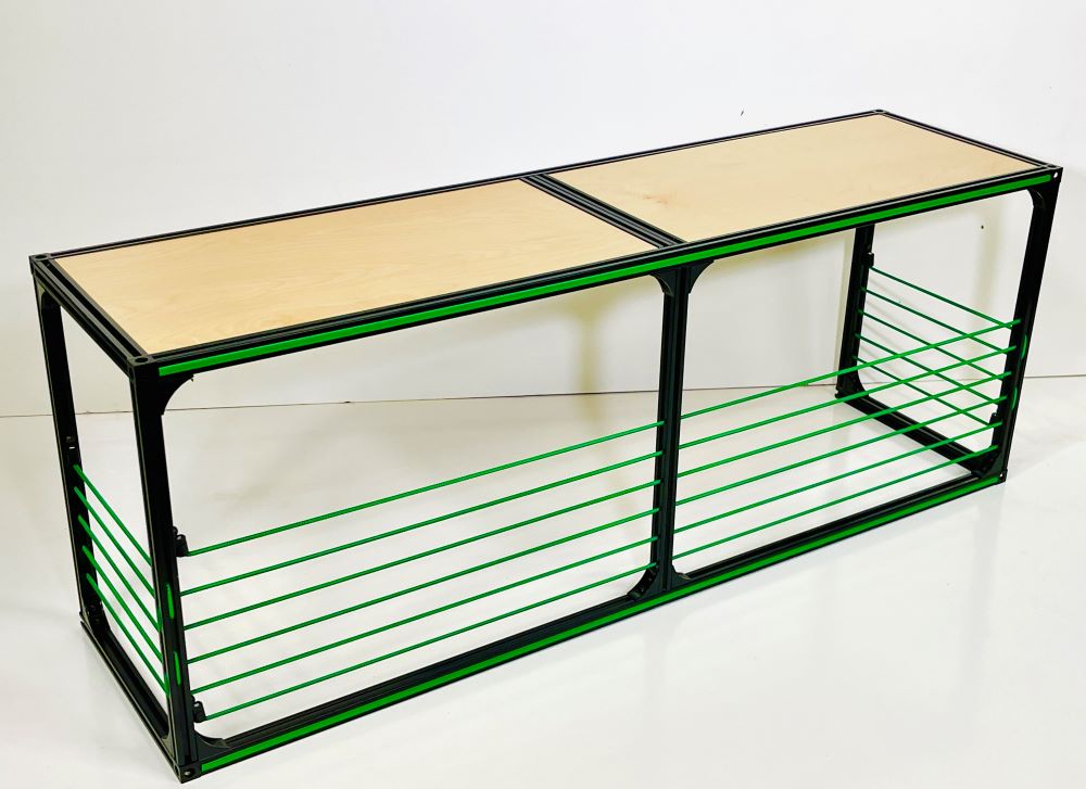 Van Wheel Well Bench Storage in camper van conversion DIY kit by TNTvans, showing built-in storage bench with wooden finish inside a camper van.
