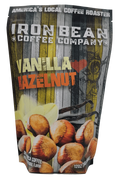 12oz bag of Iron Bean Coffee Company's Vanilla Hazelnut coffee with a rich, aromatic blend and nutty flavor.