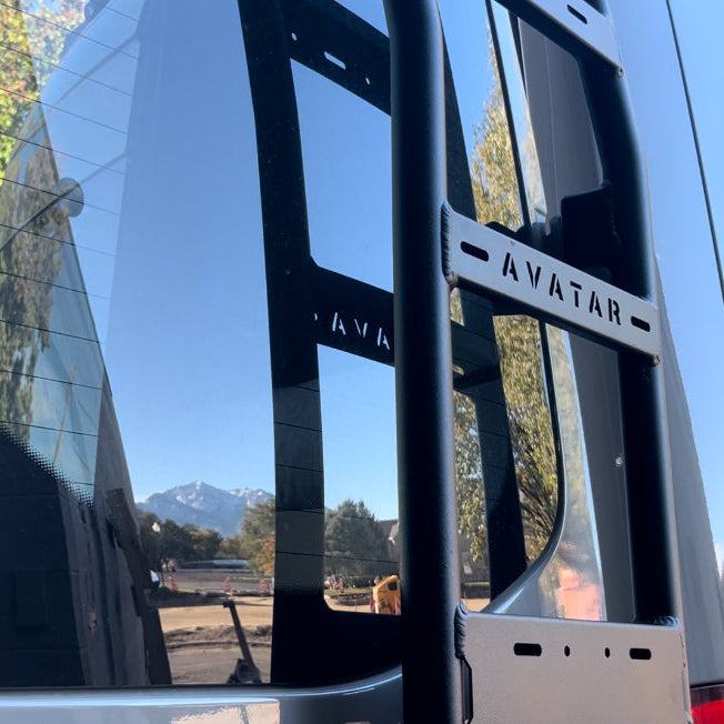 Avatar Offroad Sprinter Van Rear Ladder mounted on the back of a van, showing sturdy metal construction and easy access design.