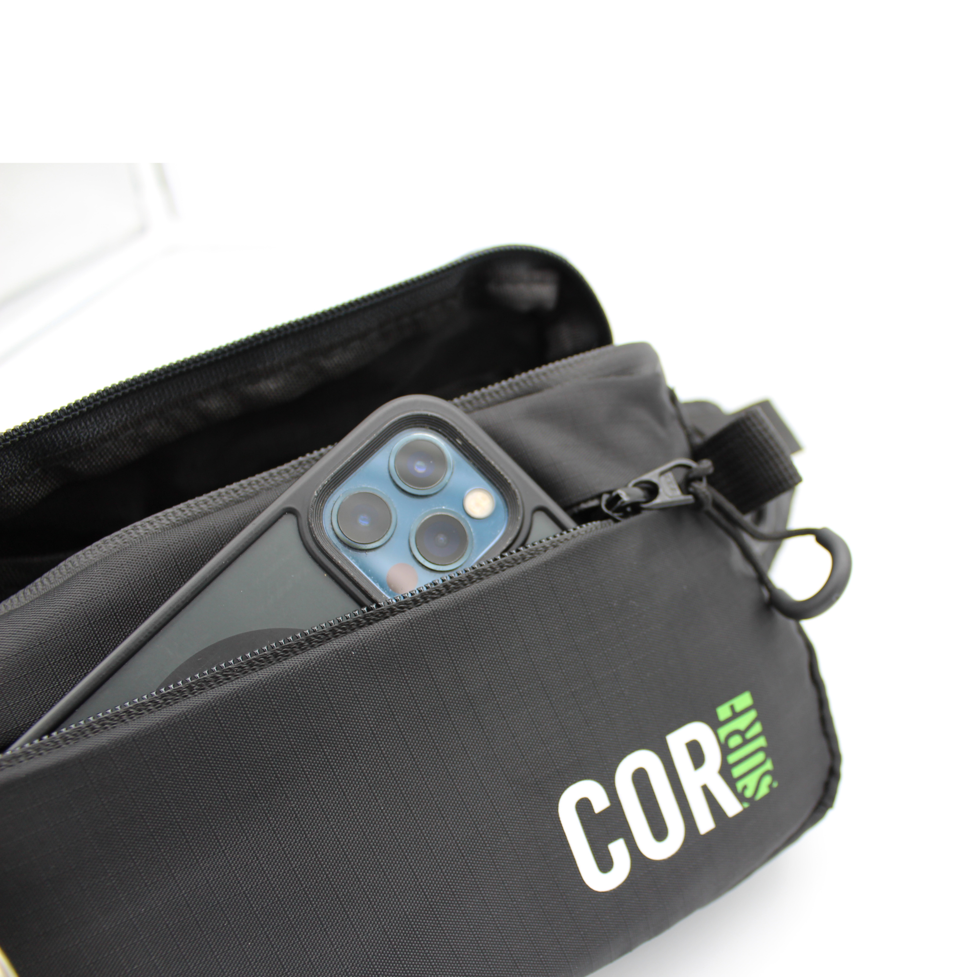 Black COR Surf Daily Cross-Body fanny pack with 1L capacity, showing its compact, adjustable waist strap and sleek design.