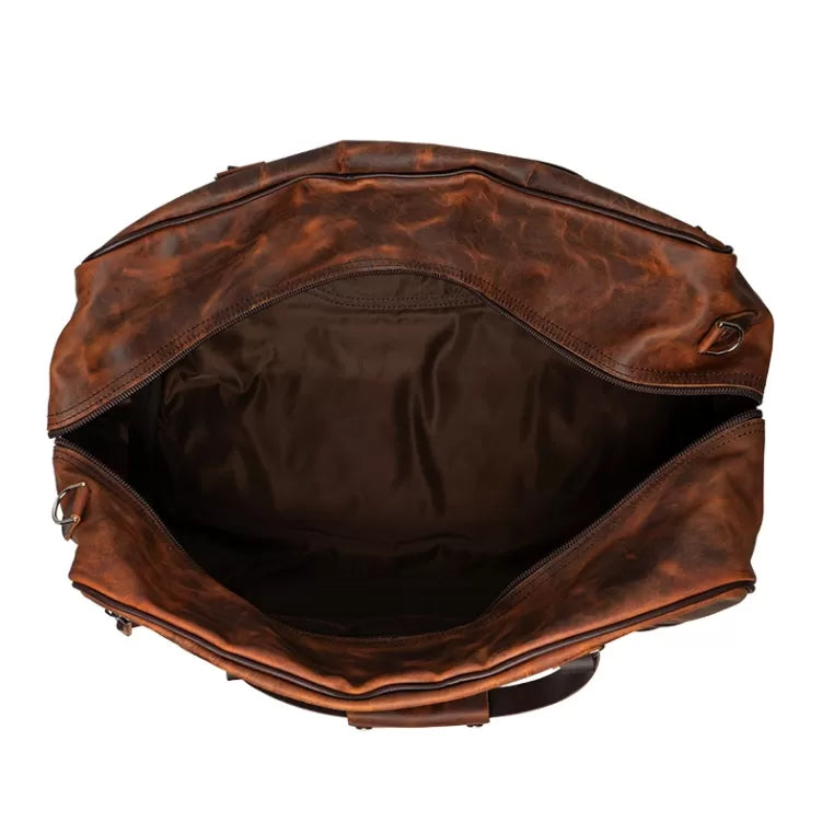 Backcountry Sportsman Heritage Leather Weekender Duffel bag with waxed leather exterior and sturdy handles on a white background.