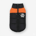 Orange Wilderness Shield vest coat by The Wild Paw, featuring durable fabric and adjustable straps for outdoor protection.
