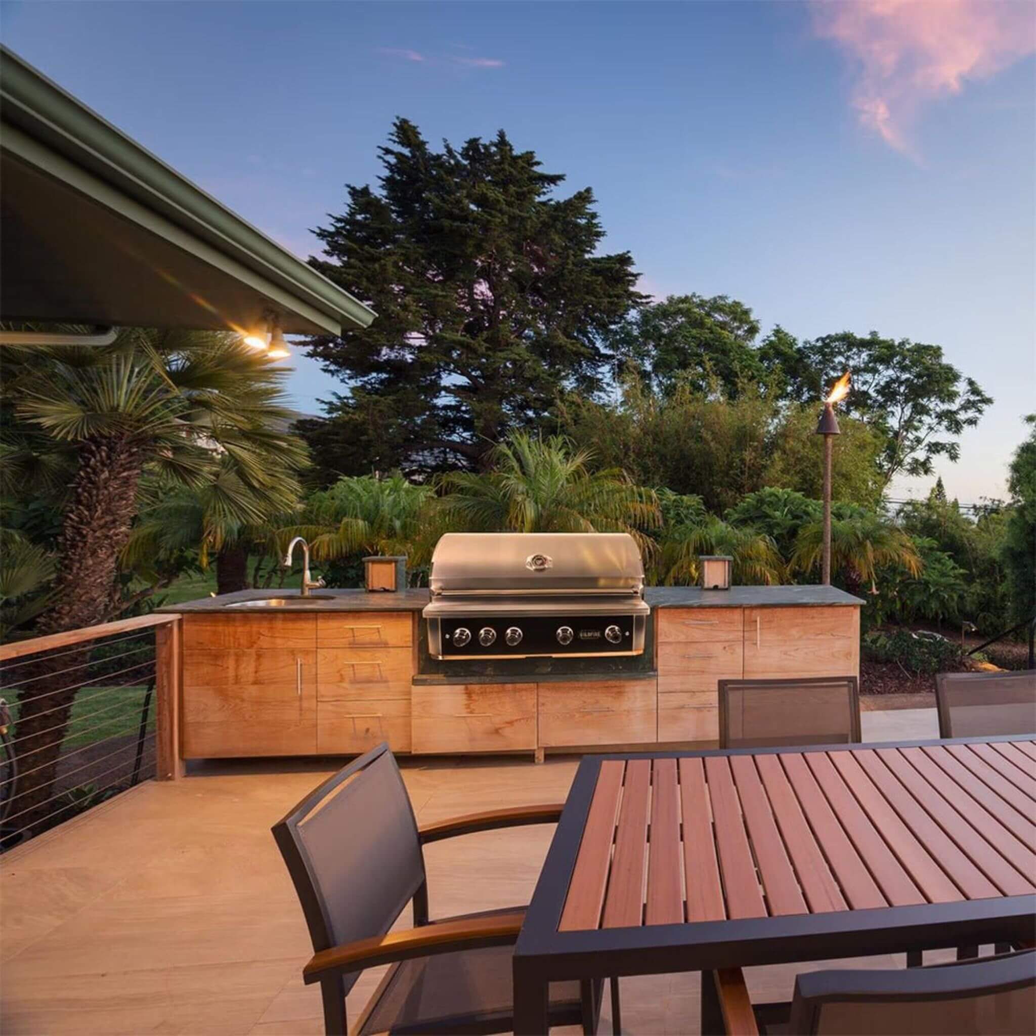 Wildfire Ranch Pro 42-inch stainless steel grill, showcasing natural gas features and sleek design in outdoor setting.