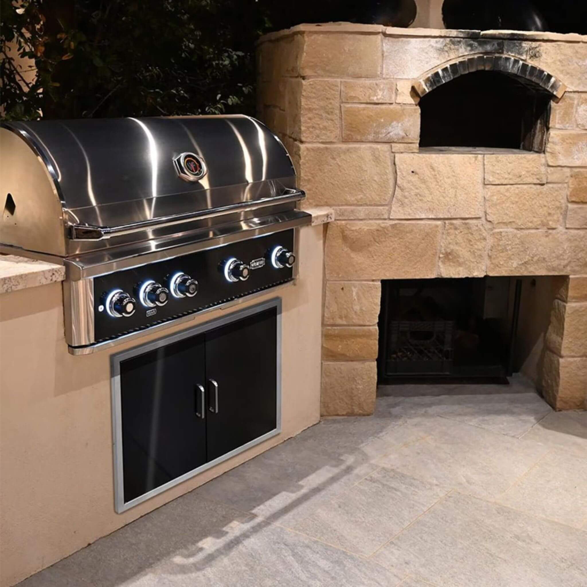 42-inch Wildfire Ranch Pro stainless steel grill in outdoor setting, showcasing sleek design and natural gas features.
