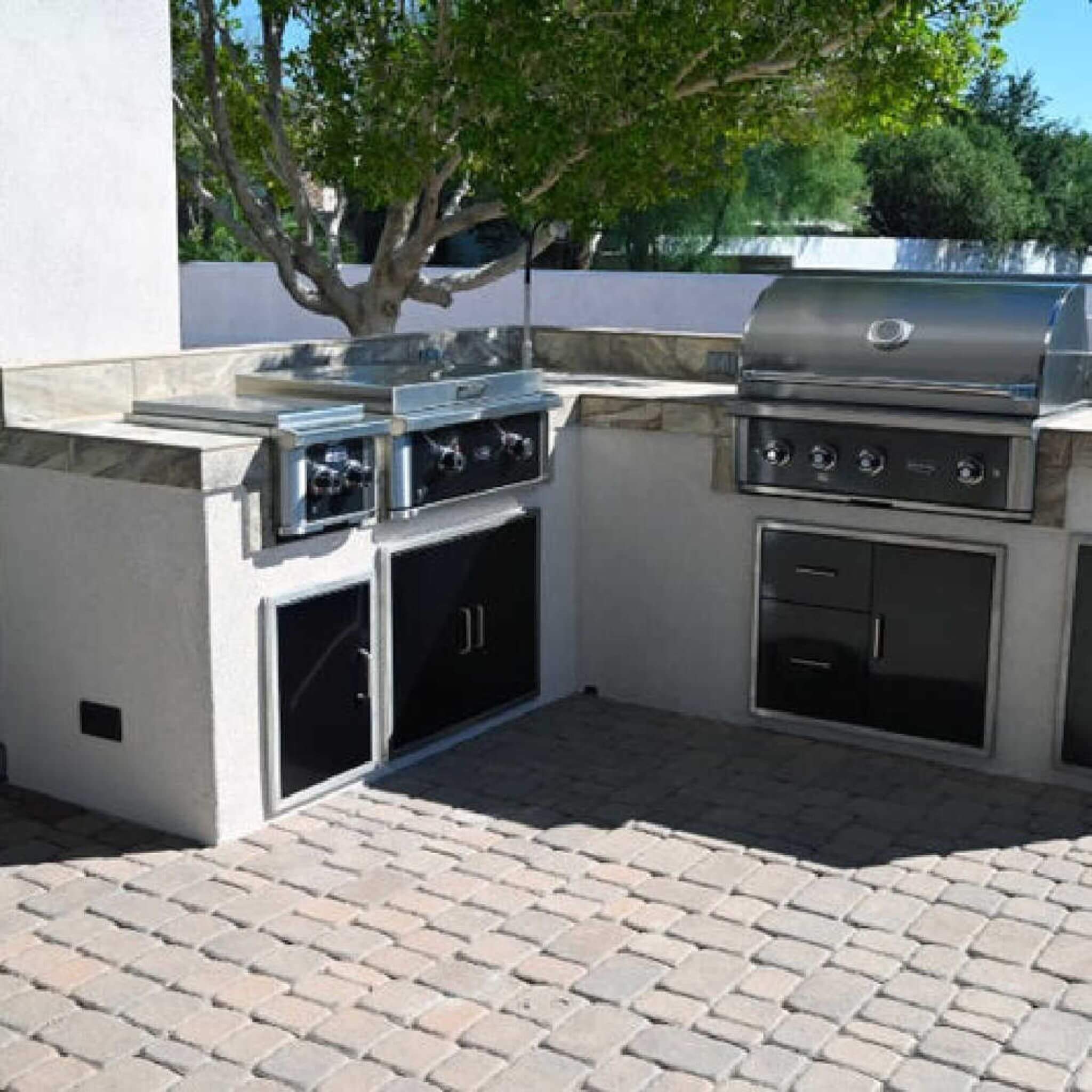 Wildfire Ranch Pro 24-Inch Stainless Steel Power Burner in outdoor kitchen setting, showcasing robust design and features.