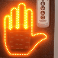 Wireless motorcycle windshield gesture light with remote control by Bean's Moto Booth, featuring touch-sensitive controls and sleek design.