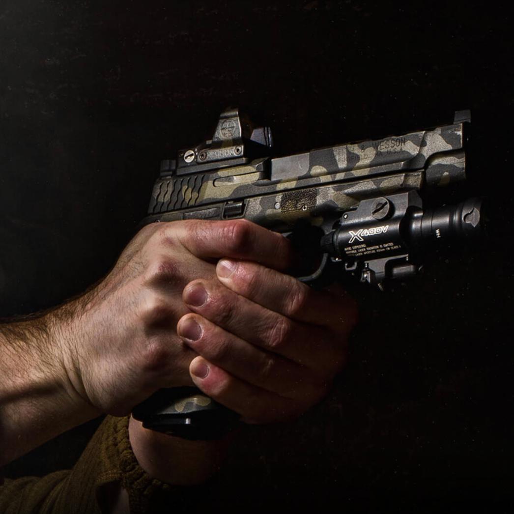 HCC Tactical X400VH Vampire weapon light, showcasing its illumination and marking features on a firearm.