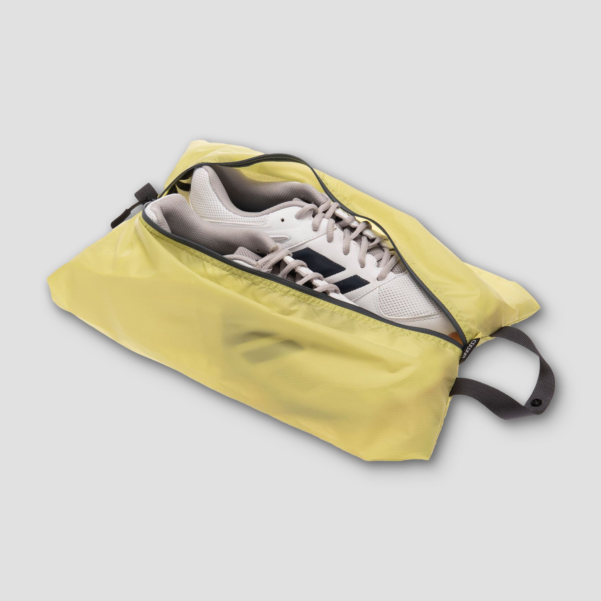 COCOON shoe bags pack with multiple fabric shoe storage cases, ideal for organizing and protecting shoes during travel or storage.
