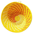 Large yellow woven African basket by Reflektion Design, showcasing intricate handwoven patterns and vibrant color.
