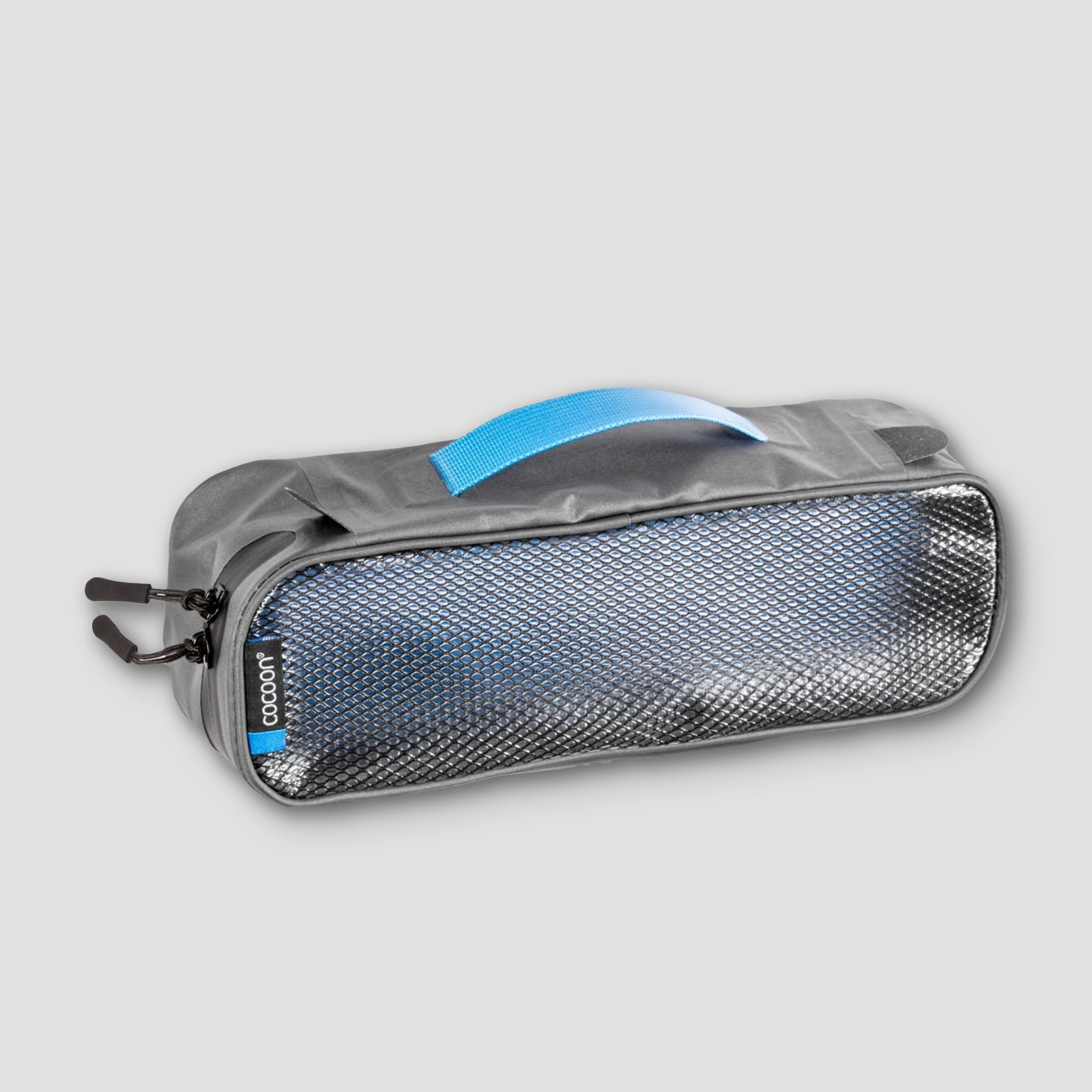 COCOON laminated packing cube for dirty and wet separation, with multiple compartments and water-resistant design.