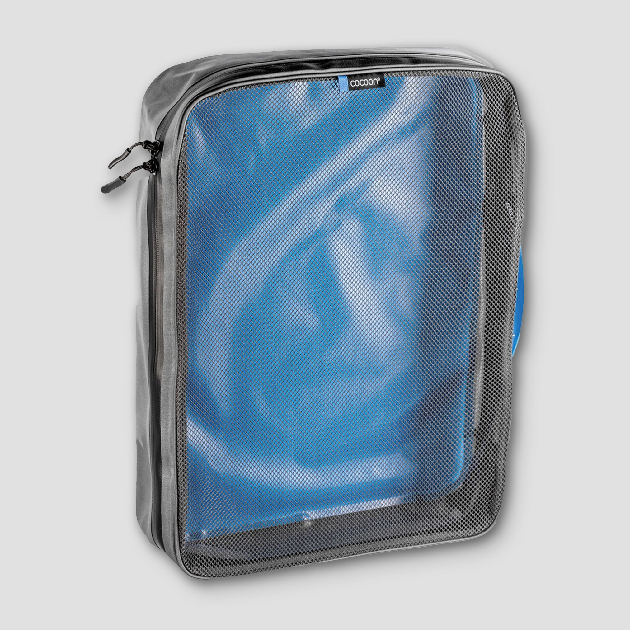 Cocoon laminated packing cube for dirty or wet clothes, with top compartment and durable waterproof material for travel organization.