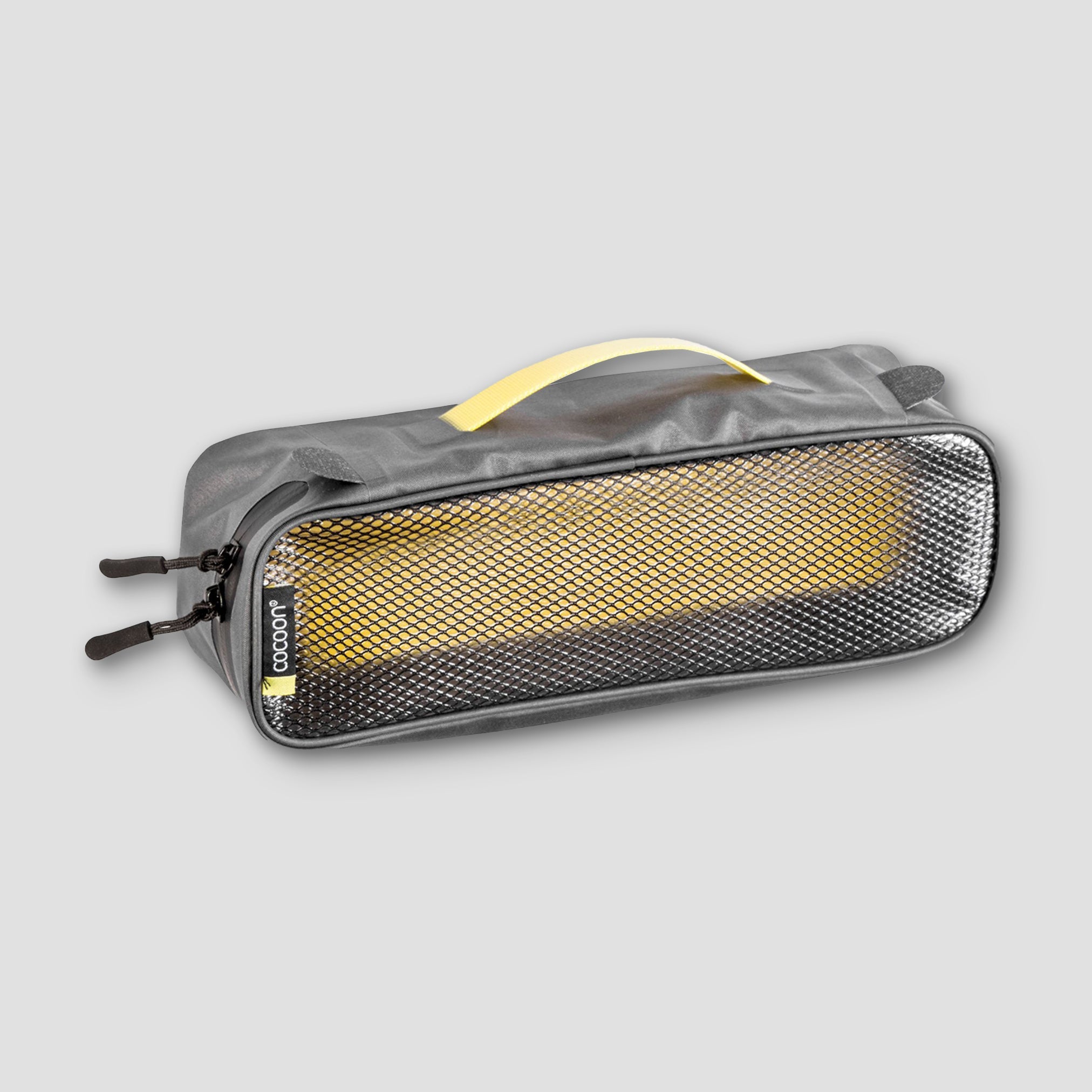 COCOON laminated packing cube for dirty or wet separation, compact and organized travel storage solution.