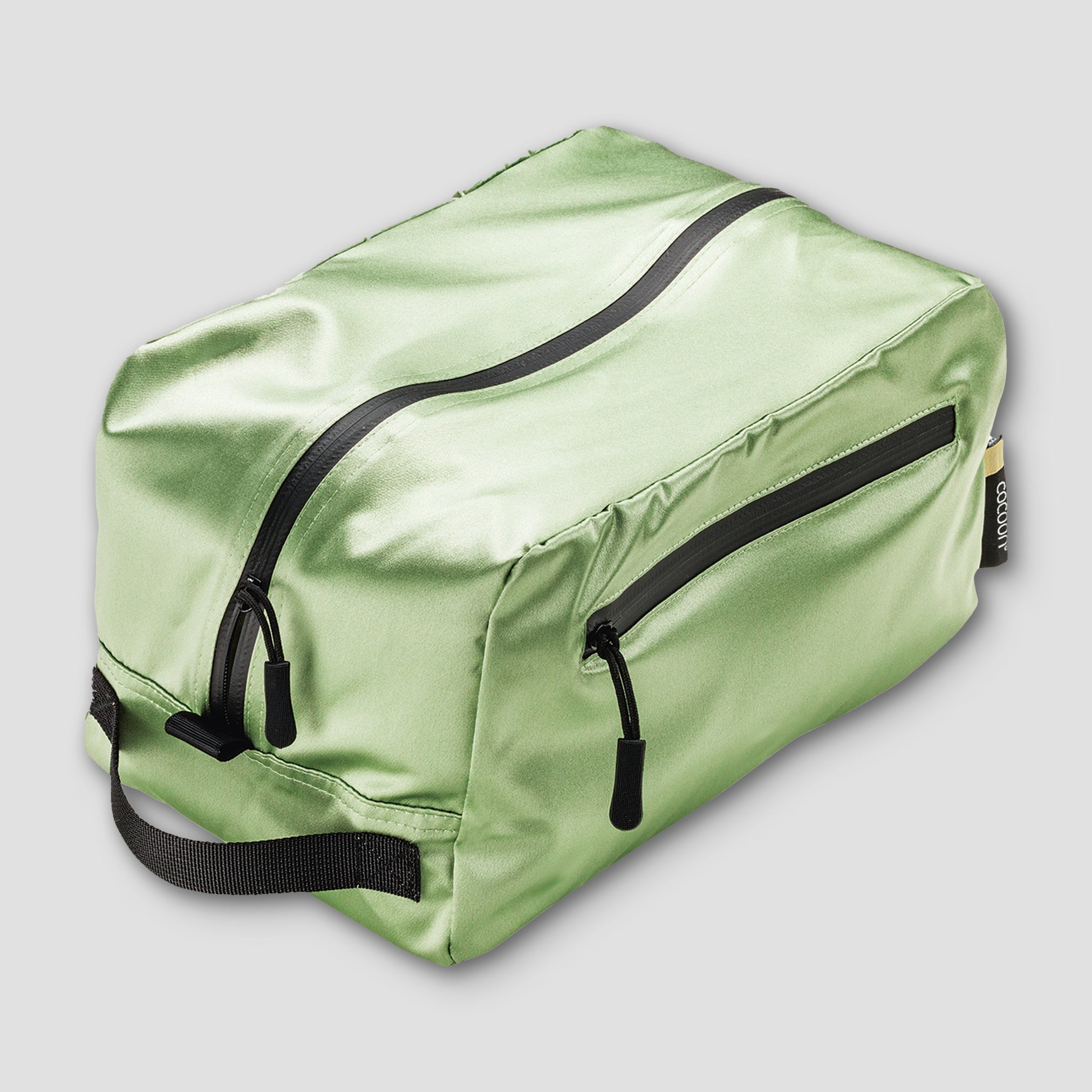 Cocoon Toiletry Kit Cube Monsoon Silk™ in sleek fabric with zipper closure, designed for organizing travel essentials.