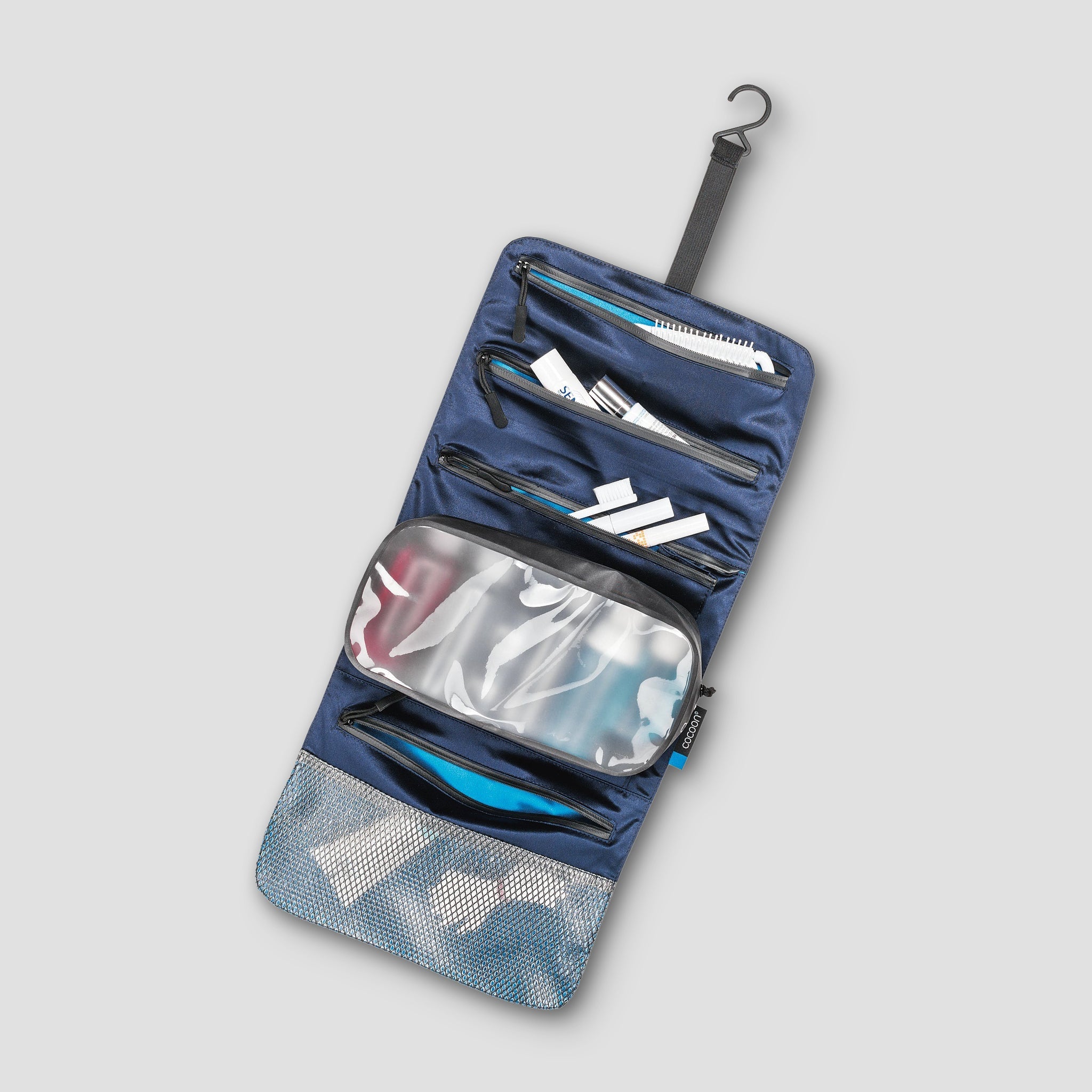 Inside view of COCOON Minimalist Hanging Toiletry Kit Monsoon Silk™ with organized compartments and sleek design.