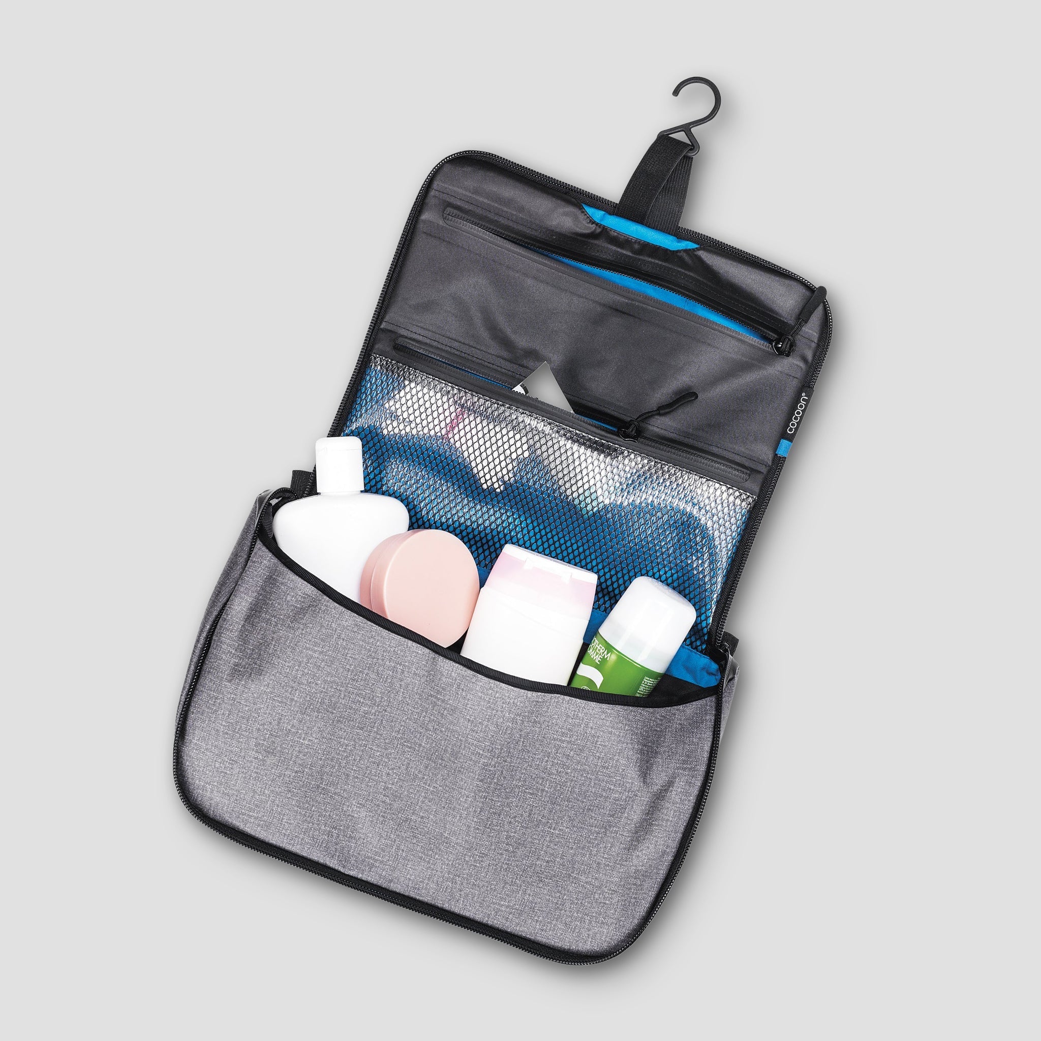 COCOON Allrounder Hanging Toiletry Kit with multiple compartments, compact travel bag, and durable design for toiletries.