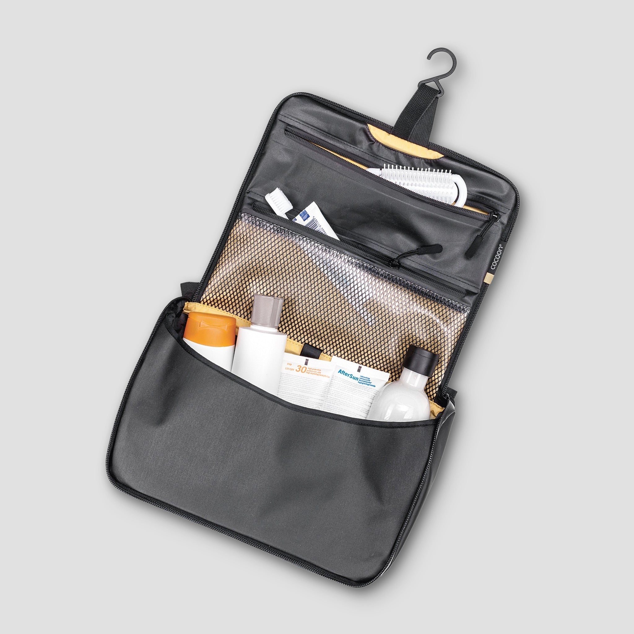 COCOON Allrounder Hanging Toiletry Kit with multiple compartments for travel toiletries and accessories.