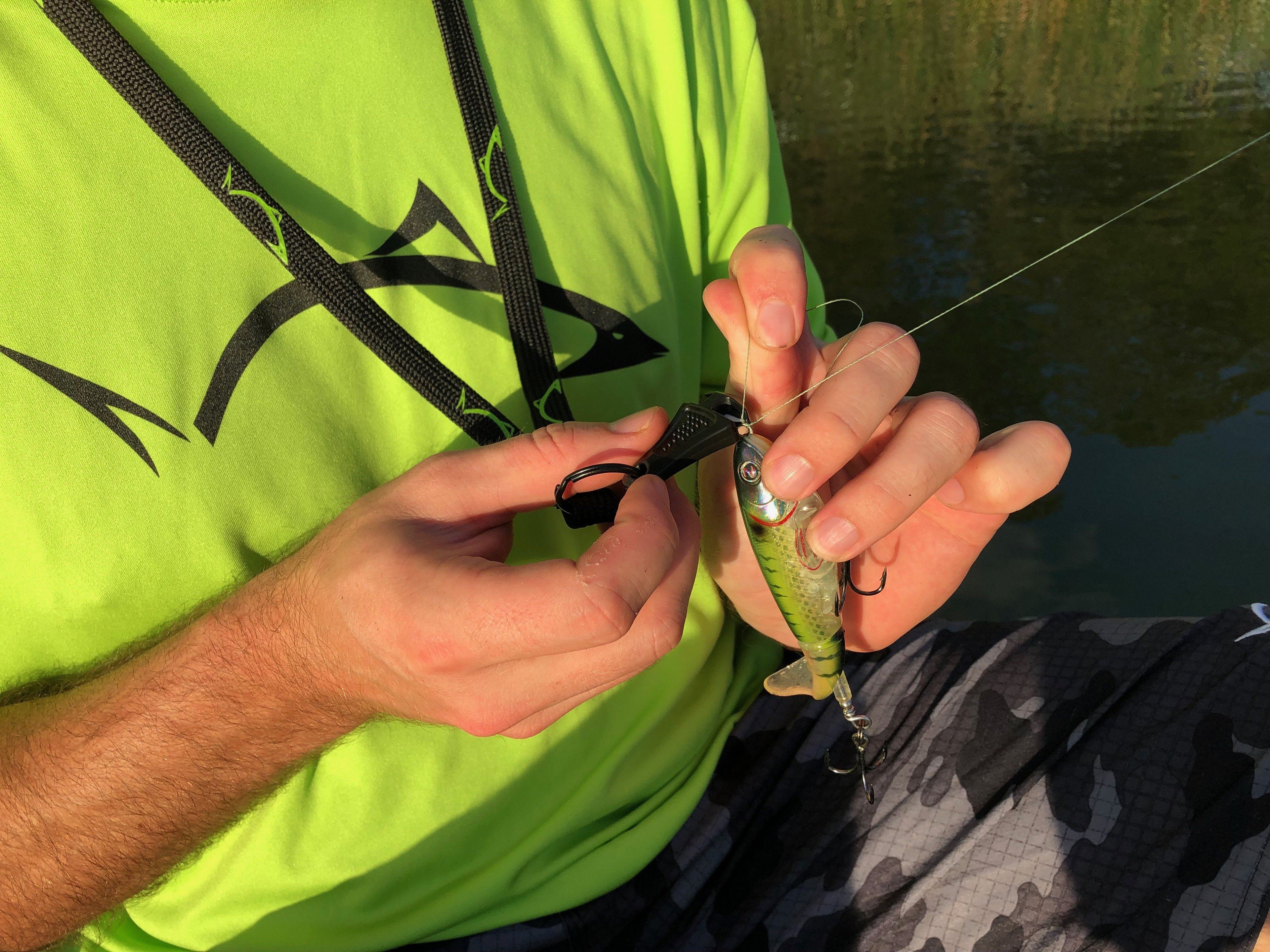 Black Line Cutterz ceramic blade zipper pull with lanyard, featuring a sleek design for easy grip and access.